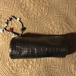 Round evening bag with embellished wrist band